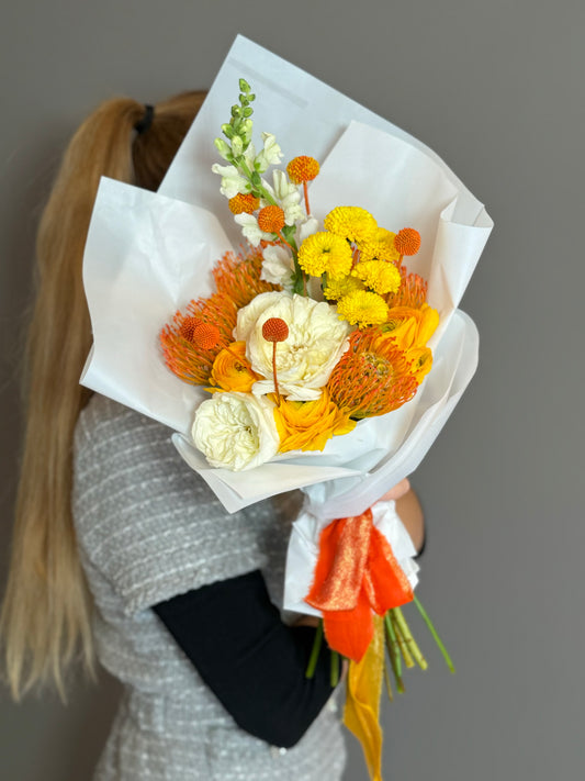 Beloved Fall. Ranunculus White & Orange, Protea Light Orange, Yellow Pom, Billy Balls Orange, Lepidium