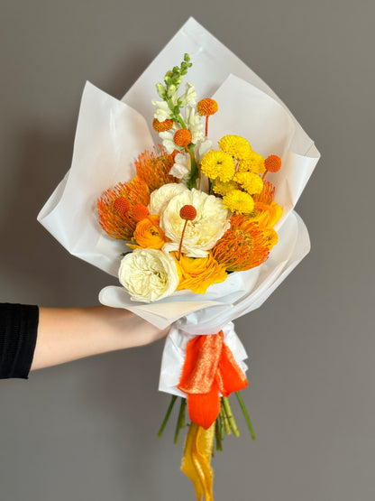 Beloved Fall. Ranunculus White & Orange, Protea Light Orange, Yellow Pom, Billy Balls Orange, Lepidium