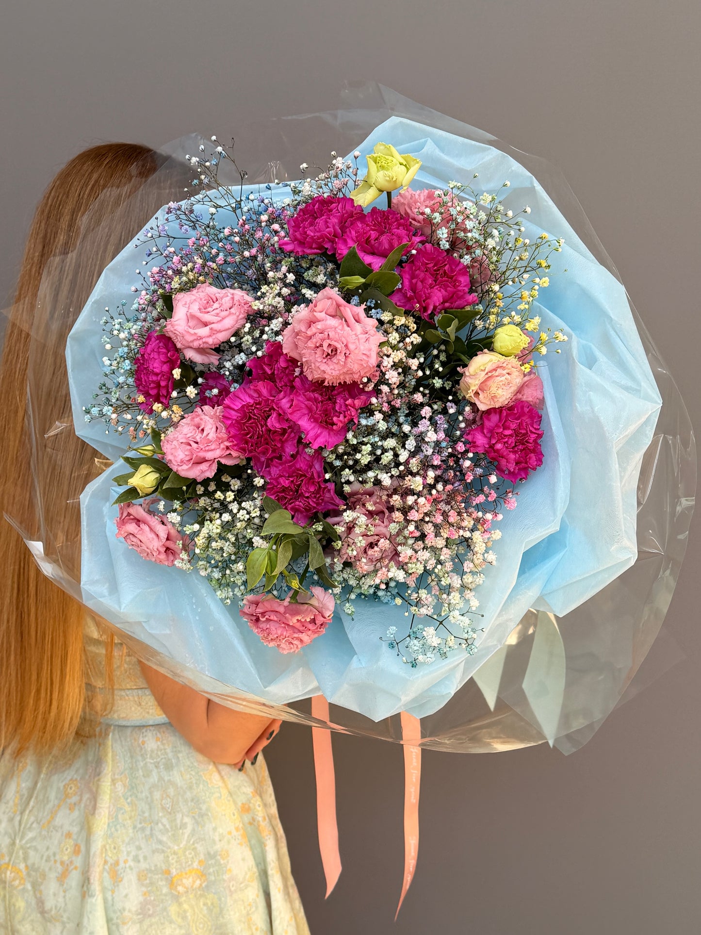 Extra-large luxury artisan flower bouquet with tinted blue and pink gypsophila, magenta carnations, and pink lisianthus wrapped in ice-blue paper by Lapin Flowers. Upscale grand delivery for Washington DC, Maryland, and Virginia.