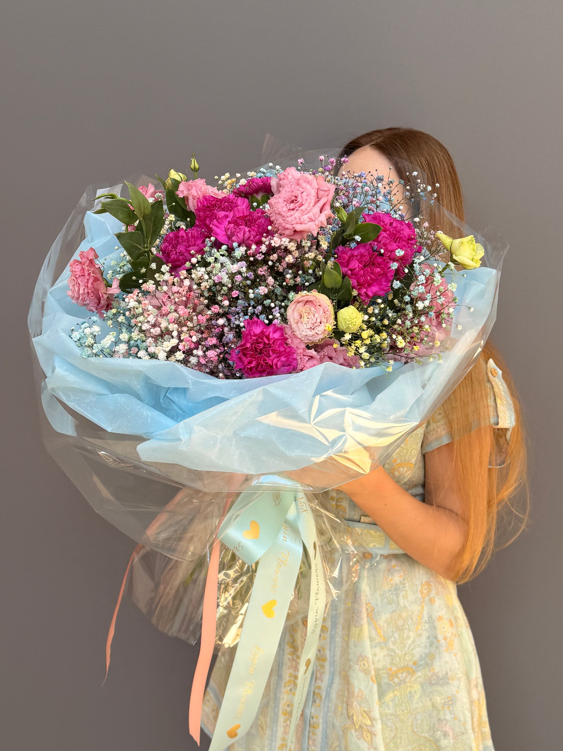 Extra-large luxury artisan flower bouquet with tinted blue and pink gypsophila, magenta carnations, and pink lisianthus wrapped in ice-blue paper by Lapin Flowers. Upscale grand delivery for Washington DC, Maryland, and Virginia.