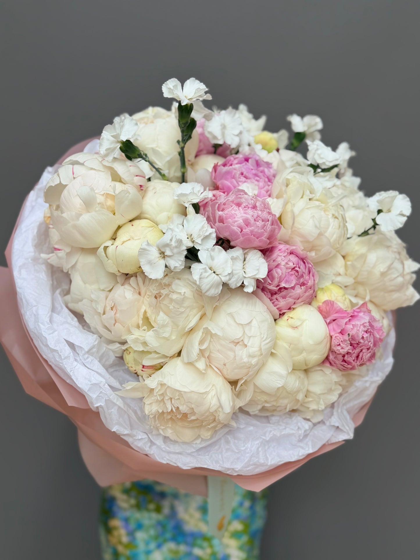 Extra-large luxury artisan flower bouquet with premium white and pink peonies, and white dianthus flowers in a soft pink wrapping paper by Lapin Flowers. Upscale floral design for delivery in Maryland, Washington DC, and Northern Virginia.⁠
