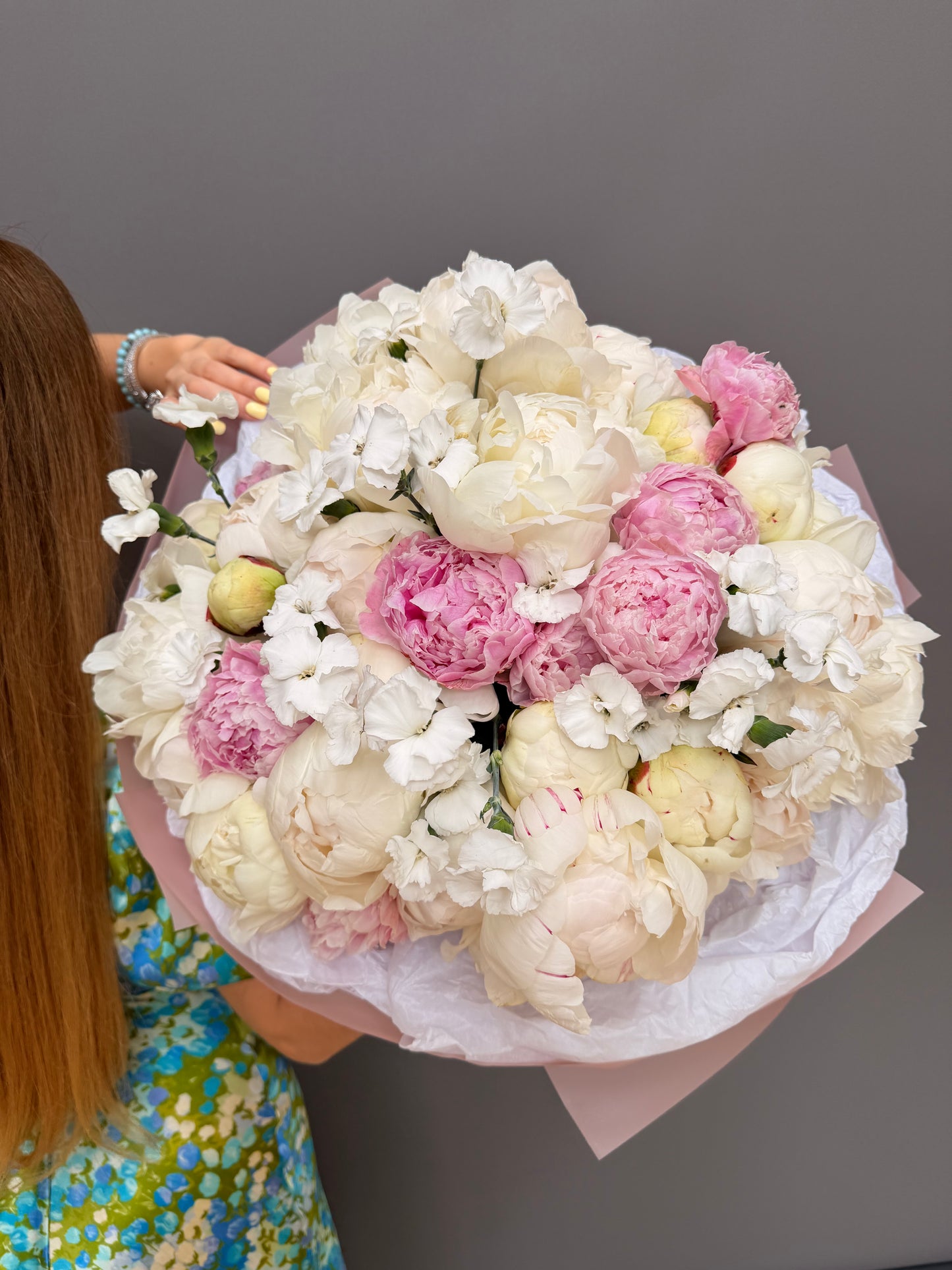 Extra-large luxury artisan flower bouquet with premium white and pink peonies, and white dianthus flowers in a soft pink wrapping paper by Lapin Flowers. Upscale floral design for delivery in Maryland, Washington DC, and Northern Virginia.⁠