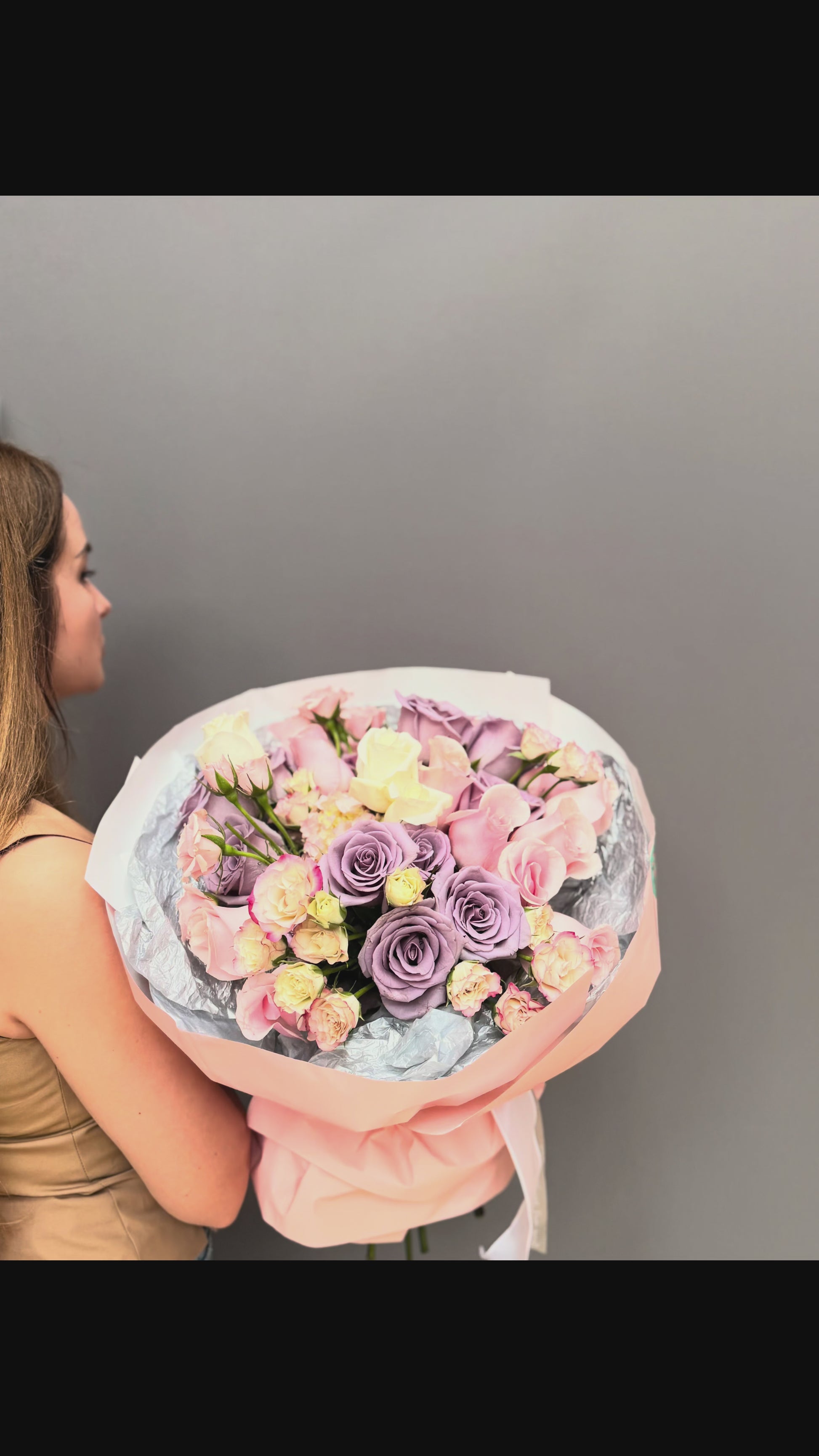 Premium luxury artisan bouquet with dusty lavender roses, blush pink roses, and pastel spray roses wrapped in peach and silver paper by Lapin Flowers. Upscale elite flower delivery for Bethesda Maryland and Washington DC.⁠