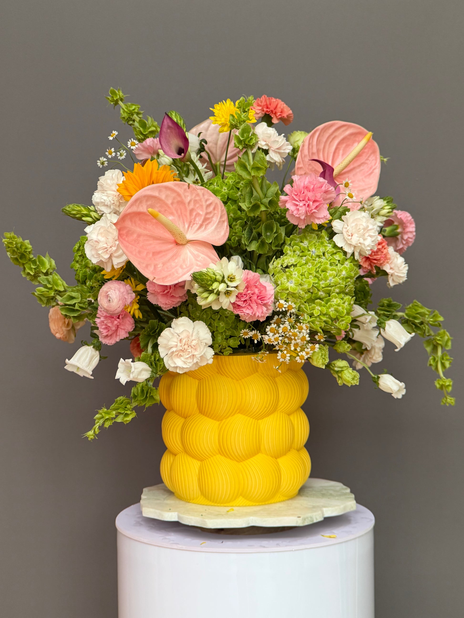 Solar Bloom Sonata pink anthurium and ranunculus in yellow 3D printed bubble vase delivery Potomac MD Bethesda McLean Lapin Flowers